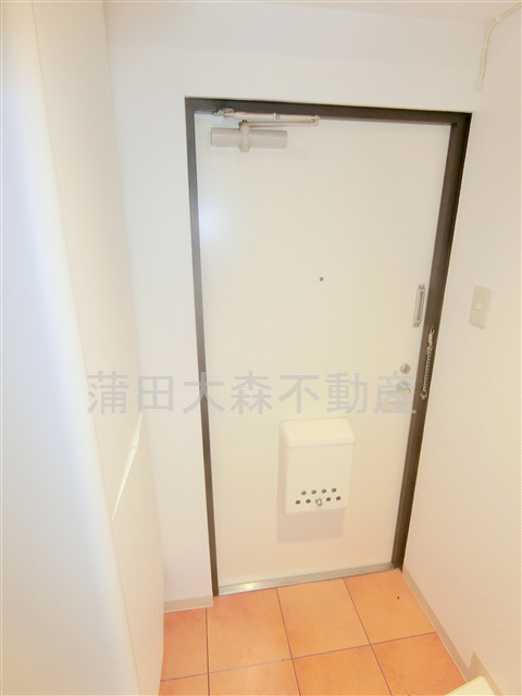 住建第7ハイプレースの玄関