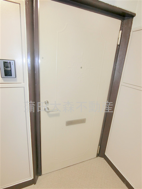 住建第7ハイプレースの玄関