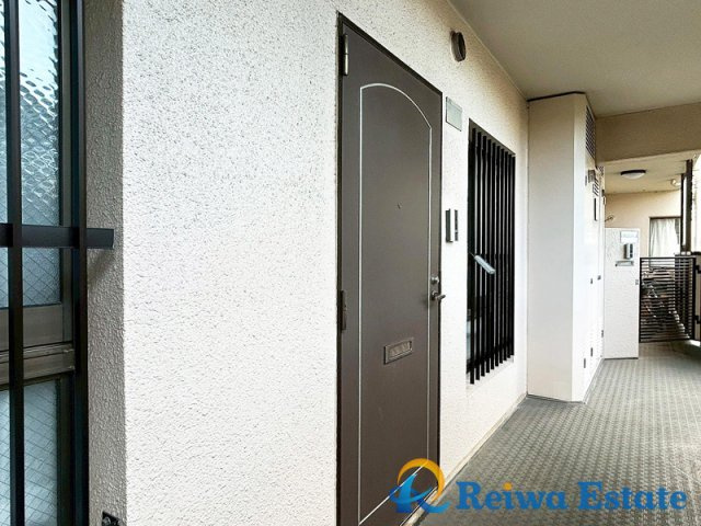 コスモ茅ヶ崎プレシオの玄関