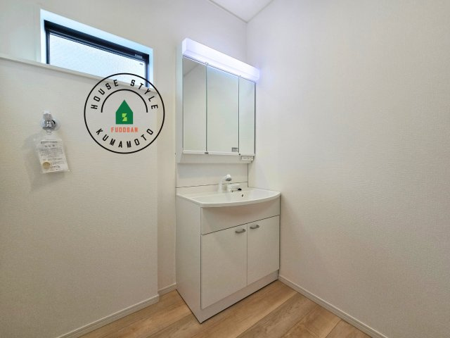 熊本市東区新生1丁目第1₋1棟(1号棟)の内観：施工例|洗面所は小さなプライベートスペース。歯磨き、洗顔と毎日施す個人空間。