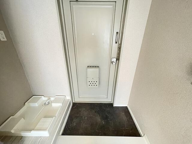 ホームズ稲田堤の玄関