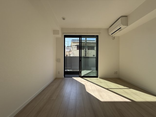 プルメリア阪大前の寝室