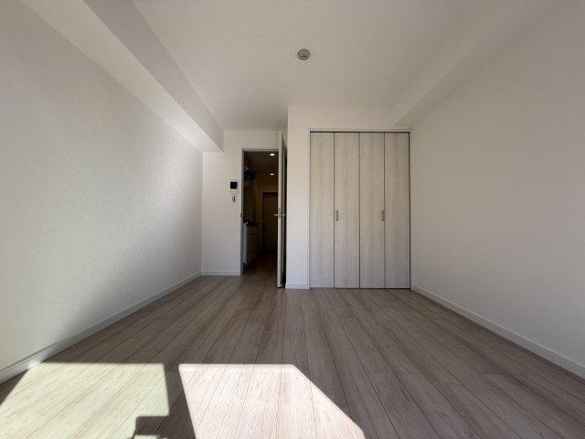 プルメリア阪大前の寝室