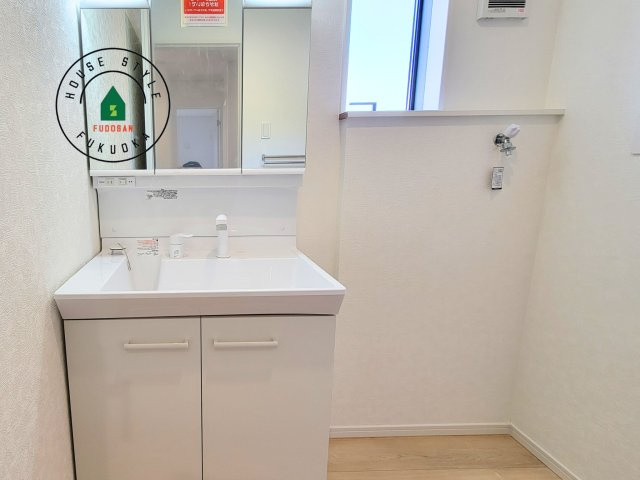 糟屋郡新宮町緑ヶ浜2丁目第2-2棟（1号棟）の内観：施工例|洗面所は小さなプライベートスペース。歯磨き、洗顔と毎日施す個人空間。