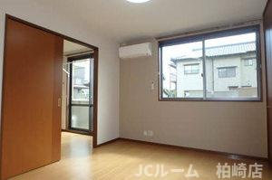 柏崎市北半田１丁目のアパートの寝室