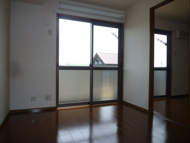 ハッピーライフ北畝Ａの洋室