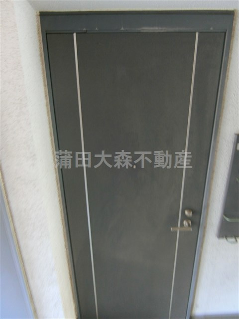 グランドフォーレヤマモトの玄関