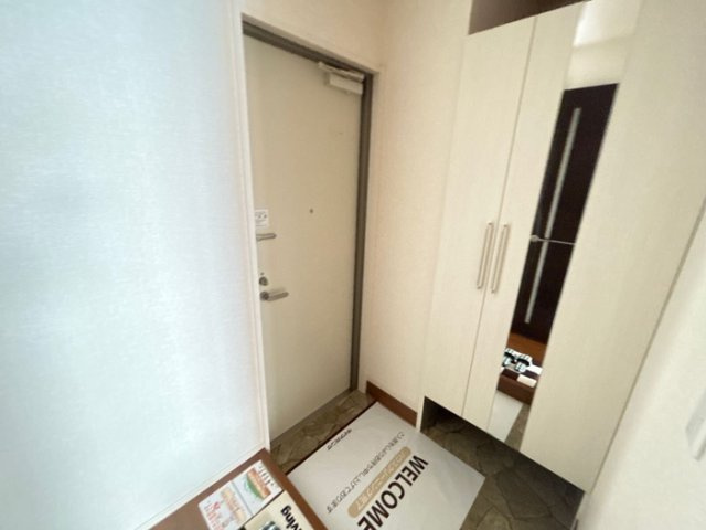 アミティエ（ﾖﾈﾔﾏﾁｮｳ）の玄関