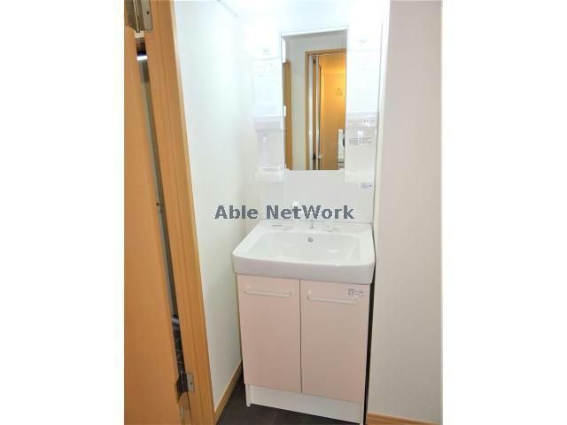 レスポワールA棟の洗面所|シャワー付き洗面台