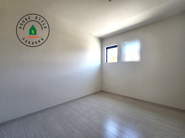 大野城市若草2丁目第2-1棟（1号棟）の内観：施工例|落ち着いた色調の洋室です。